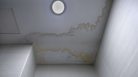 water stain on ceiling below balcony