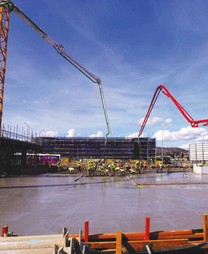 workers gathered to pour concrete 