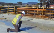worker looking at quality of concrete