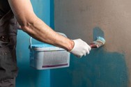 painting on blue waterproofing